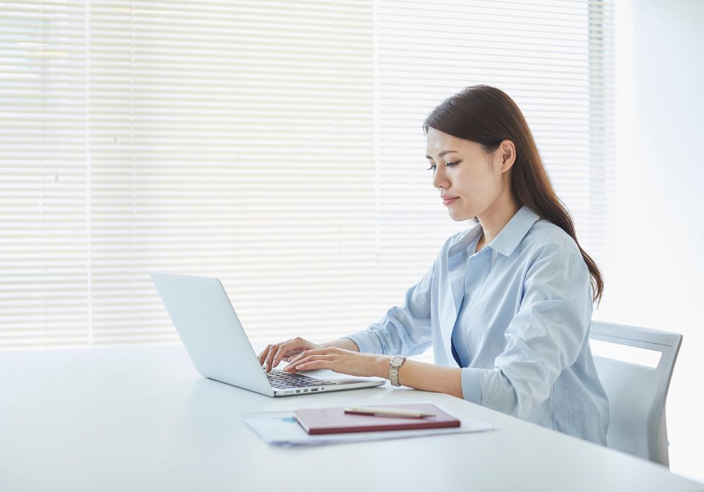 Midlife woman working, challenging ageism during perimenopause and menopause