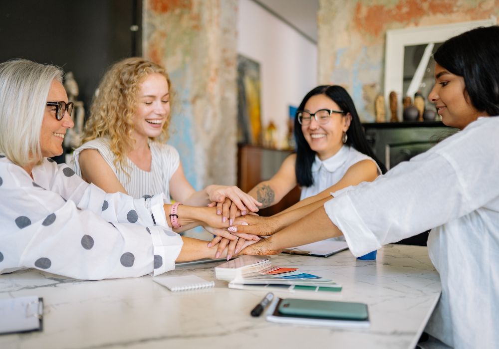 Women of different ages working together in harmony, challenging female ageism