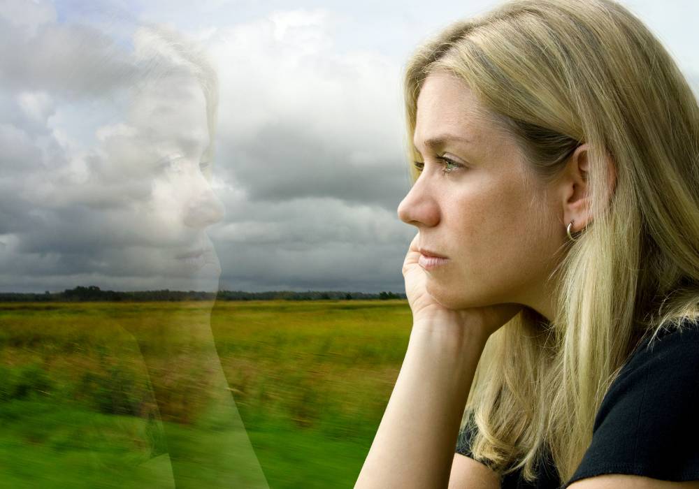 Woman reflecting on her emotions during menopause transition, building self-awareness